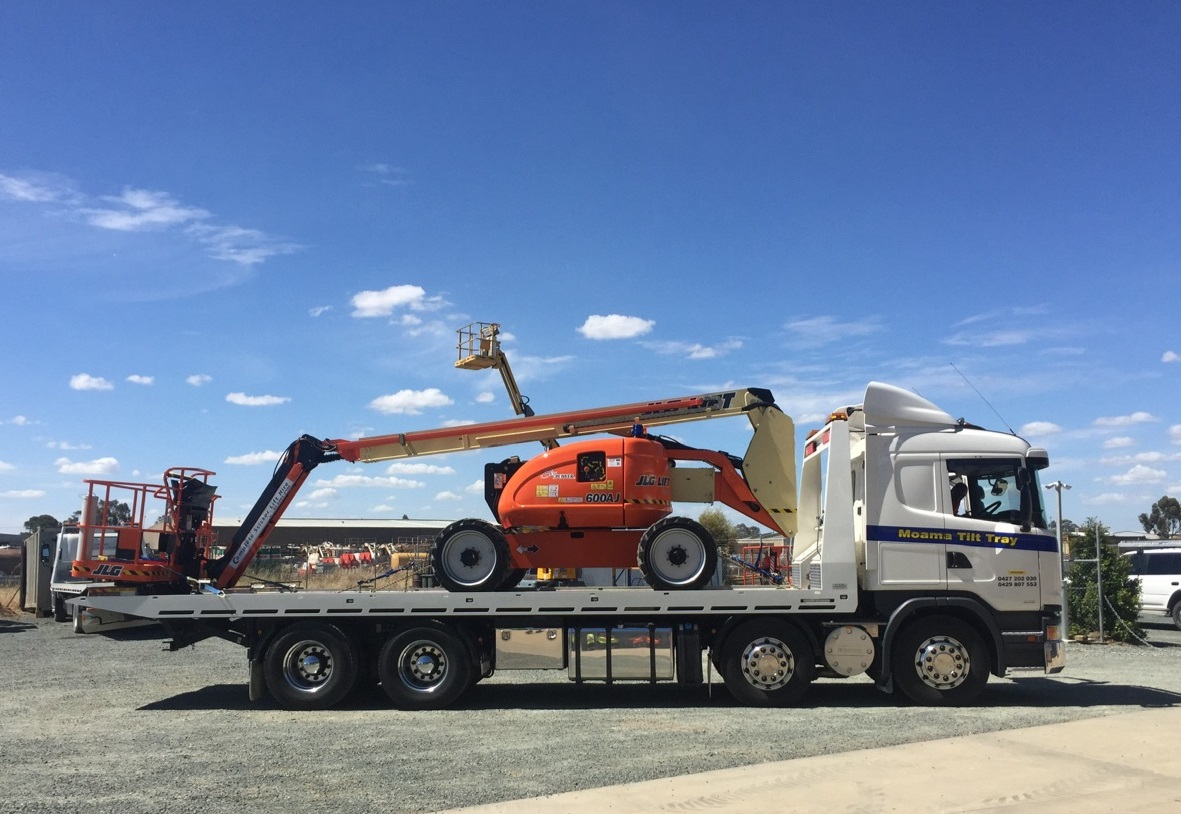 Truck loaded with Knuckle Boom