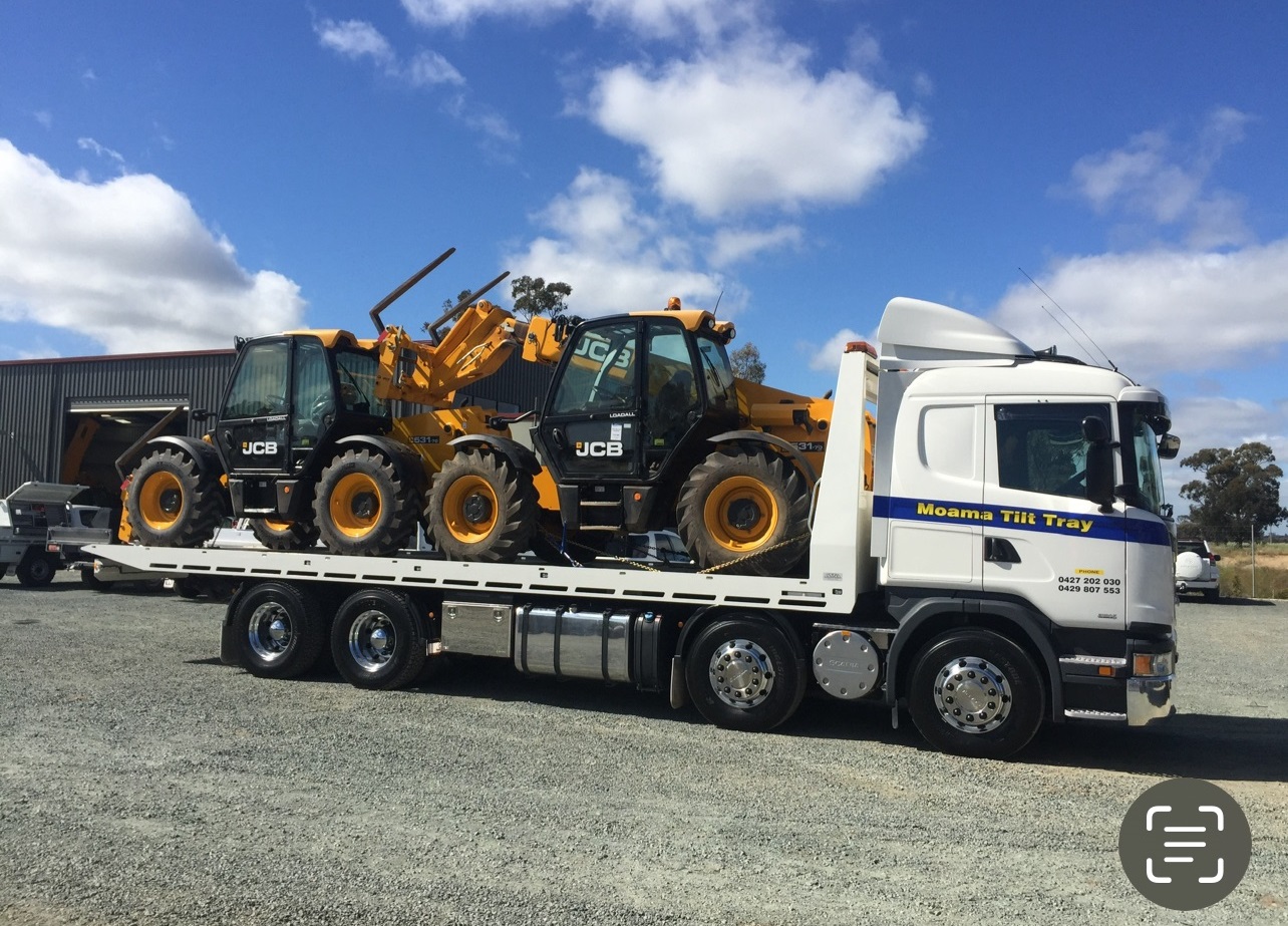 Truck loaded with 2 telehandlers ready for delivery